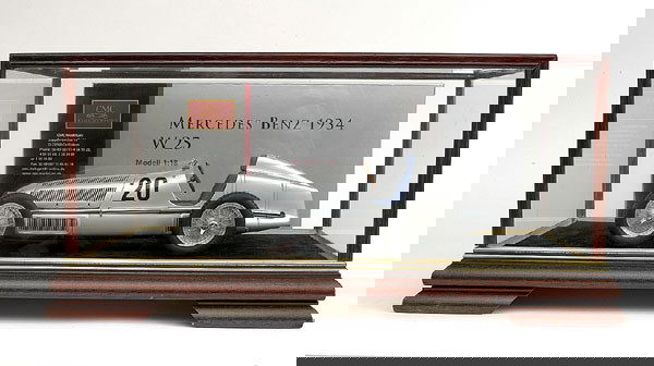 CMC 1934 Mercedes Benz W25: CMC 1/18th scale 1934 Mercedes Benz W25 - silver, racing number 20 - 1st 1934 German Grand Prix - Nurburgring - driver Manfred Von Brauhitsch - condition is Mint including outer box - this model also