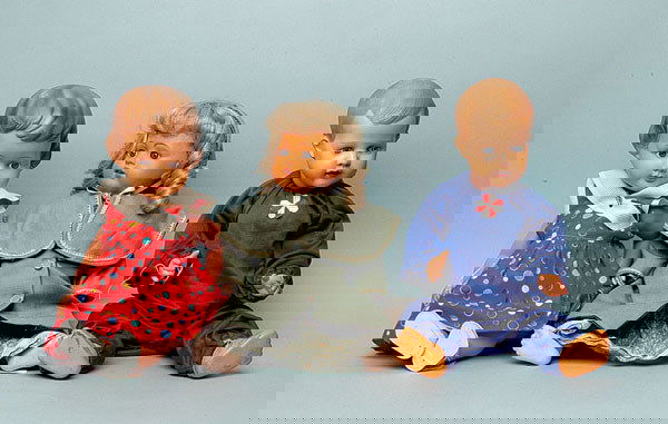 Bruno Schmidt celluloid doll, German: Bruno Schmidt celluloid doll, German, weighted blue eyes, open mouth, pate replaced - wig rim split, five piece composition body, fingers and toes rubbed, 16"/41cm; together with a Storkmark celluloid