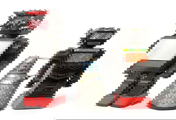 A collection of battery operated Robots: A collection of four battery operated Robots including Kamco Saturn; Bandai Algas game; Besford Robot; Jupiter TV screen; all boxed; plus a pair of Daleks - Tomy and Marx, damaged, Fair to Excellent.