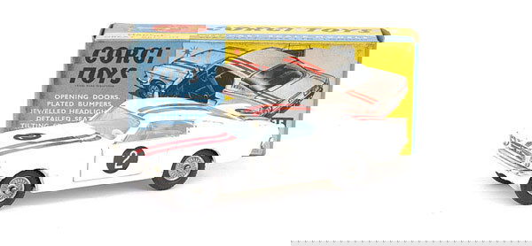 Corgi Toys No.325 Ford Mustang Competition: Corgi Toys No.325 Ford Mustang Competition - white, red body stripes, very pale blue interior, racing number 2 labels applied, cast hubs - Excellent in Excellent grubby blue and yellow box.