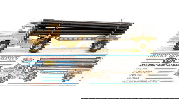 French Dinky No.893 Unic Sahara Tractor: French Dinky - No.893 Unic Sahara Tractor with pipe load - beige prime mover and trailer including hubs, white roof box, with 6 x black plastic pipes - Excellent Plus in Good Plus blue and white strip