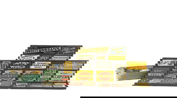 Bassett-Lowke Tin Signs: Bassett-Lowke and similar tin signs mounted on four wooden boards consisting of Gold Flake, Wills Capstan, The Viking Cruising Company, Bass Beers, Hudson Soap, amongst others. The lot also includes 4