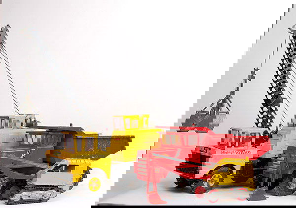 A Group of Pressed Steel Trucks: Structo, Buddy L, Hubley, Tonka US pressed steel trucks. Lot includes Buddy L Mack Hydraulic 6-wheeled Dump Truck(lacks front bumper), 52cm, Tonka Mighty Loader 50cm, Crane Truck, 80cm, Structo 6-whee