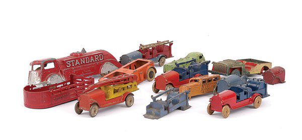 A Group of Tootsietoys Early Fire Trucks: Tootsietoys (USA) early Fire Trucks - lot includes, (1) Hook and Ladder Truck - orange, blue with only one ladder (one side of ladder broken), (2) Hook and Ladder Truck - blue, with repainted red base