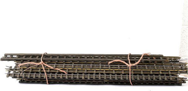 Bassett-Lowke and similar 3-rail Track: Bassett-Lowke and similar wooden sleepered 3-rail steel and brass centre rail track consisting of Points x 12, 38" Straights x 38+, 18" Straights x 60, 18" Curves x 4 and 2-rail Points x 4. The lot al