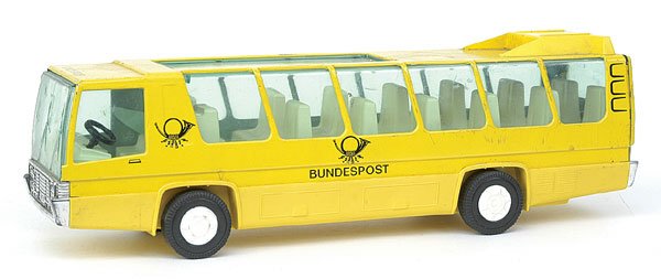 Plastic & Tin Bundespost Single Deck Bus Joustra: A plastic and tinplate model of a Bundespost Single Decker Bus by Joustra of France - yellow with postal insignia, cream interior, some bright parts, lacks friction drive and would benefit from cleani