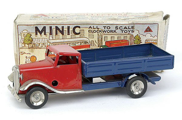 Minic - 10M Delivery Lorry - Post-war - red: Minic - 10M Delivery Lorry - Post-war version - red standard cab - blue rear open body - plated radiator with rounded wings - tin hubs with black tyres - Excellent in P - illustrated box - old marks a