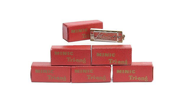 Triang Minic Mouth Organ: Triang Minic Mouth Organ - lot comprises 6 x Minic miniature mouth organs, ex shop stock items have bright plated finish and are generally Near Mint to Mint including red card sleeves. (6)