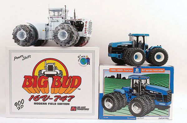 A Pair of 1/32nd scale Tractors: Pair of 1/32nd scale Tractors. (1) Ertl Collectors Edition New Holland 9882 Articulated Tractor, (2) Diecast Promotions Big Bud 16V-747 Articulated Tractor complete with Certificate of Authenticity bo