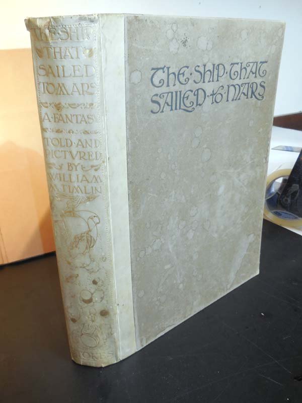 Ship That Sailed To Mars: Timlin, William 1st American edition Frederick Stokes 1923. Bound in 1/2 vellum calligraphic text and 48 color plates mounted on gray leaves throughout. Tear to the vellum at the top of the spine. Whi