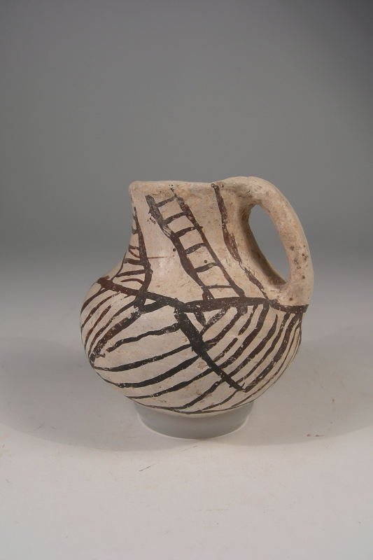 Anasazi Miniature Jar: A small Anasazi Chaco jar, Ca. 900 - 1075 A.D. - I believe this small jar was made by a child that was learning the art. I also believe she painted what she saw, as the design around the top resembles