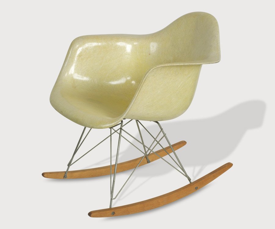 Eames Rocking Chair: Early Herman Miller manufactured chair with original Zenith label, later rocker base. Height:69cm Depth:69cm Width: 63cm