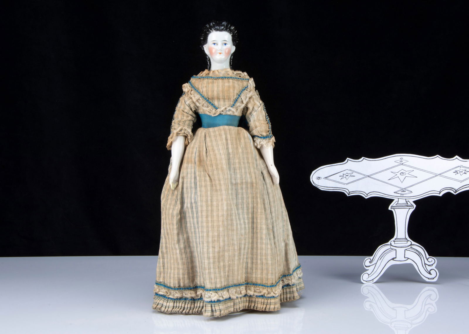 A mid 19th century German china shoulder head doll with elaborate hair, (1 of 3)