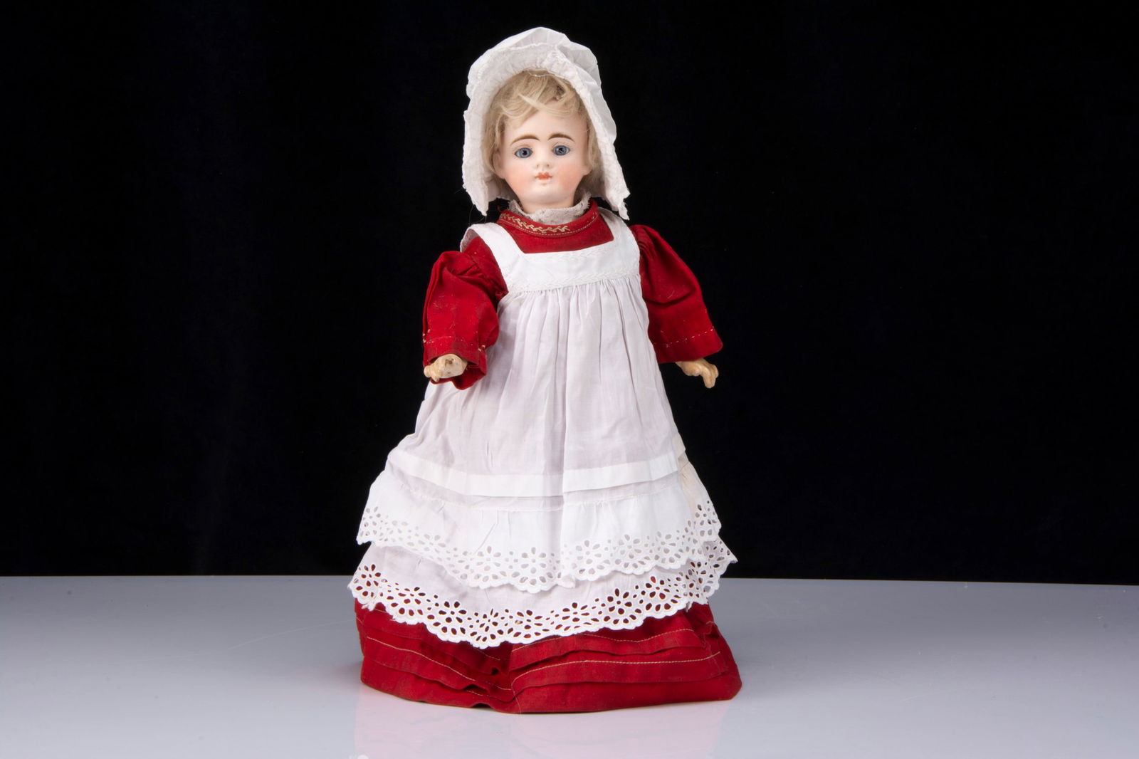 A German bisque headed closed mouth doll with walking mechanism, (1 of 2)