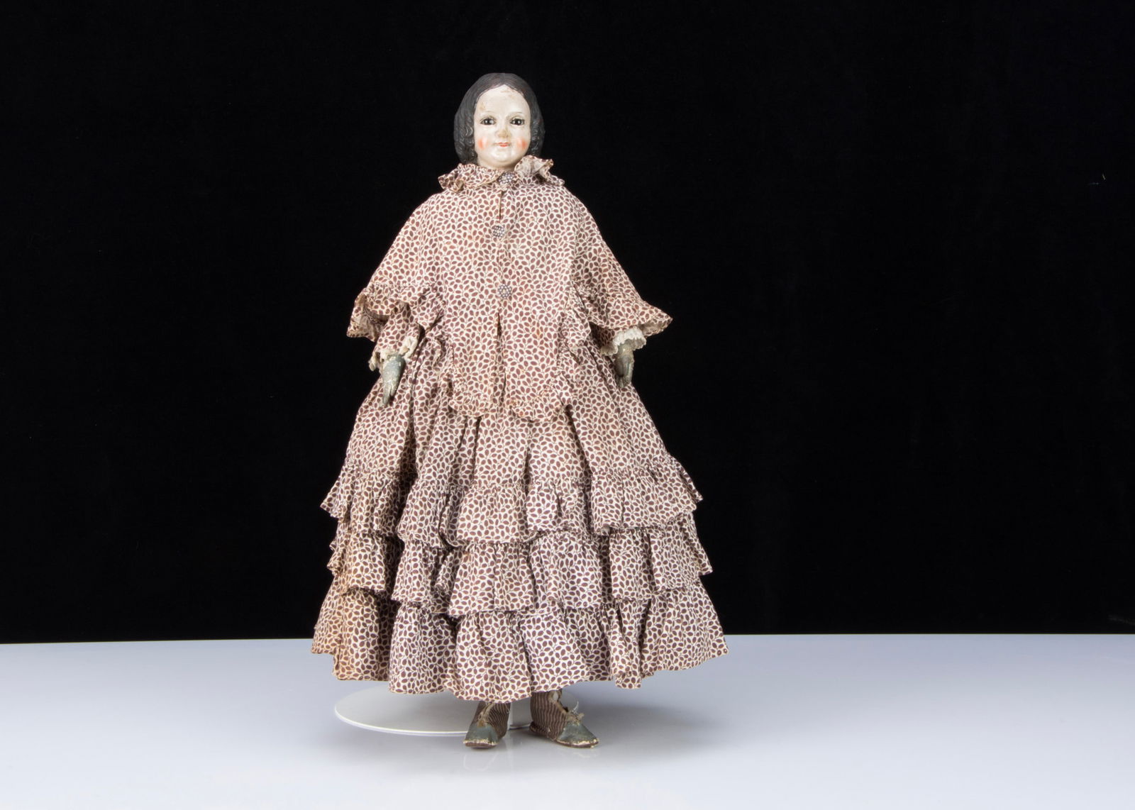 A very rare mid 19th century gutta percha shoulder head doll with glass eyes, (1 of 3)