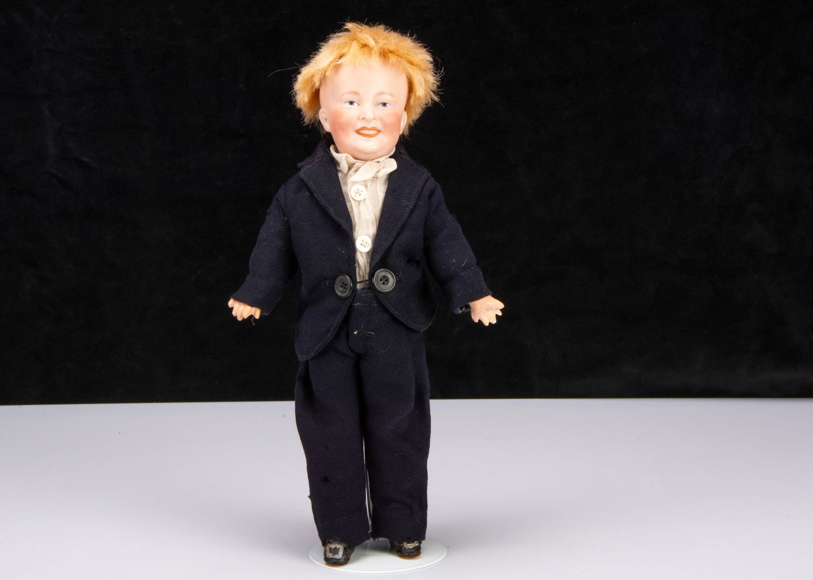 A rare German bisque headed character boy marked DEP TM 09,: A rare German bisque headed character boy marked DEP TM 09, possibly by Ernst Winkler with blue painted narrowed eyes, black top eyeliner, light brown feathered brow, open/closed smiling mouth showing