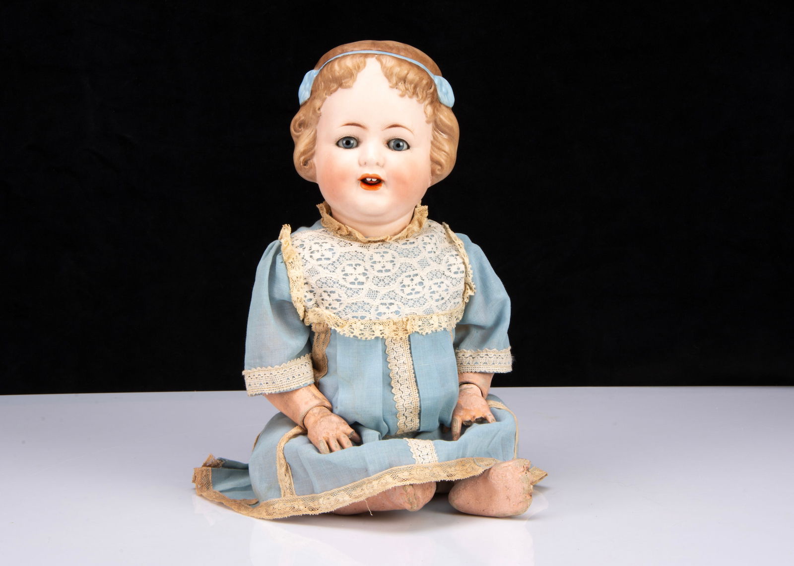 A rare Alt, Beck & Gottschalck 1358 character girl,: A rare Alt, Beck & Gottschalck 1358 character girl, with blue sleeping eyes, brown feathered brows, open mouth with two teeth and tongue, light brown painted and moulded bobbed centre-parted hair held