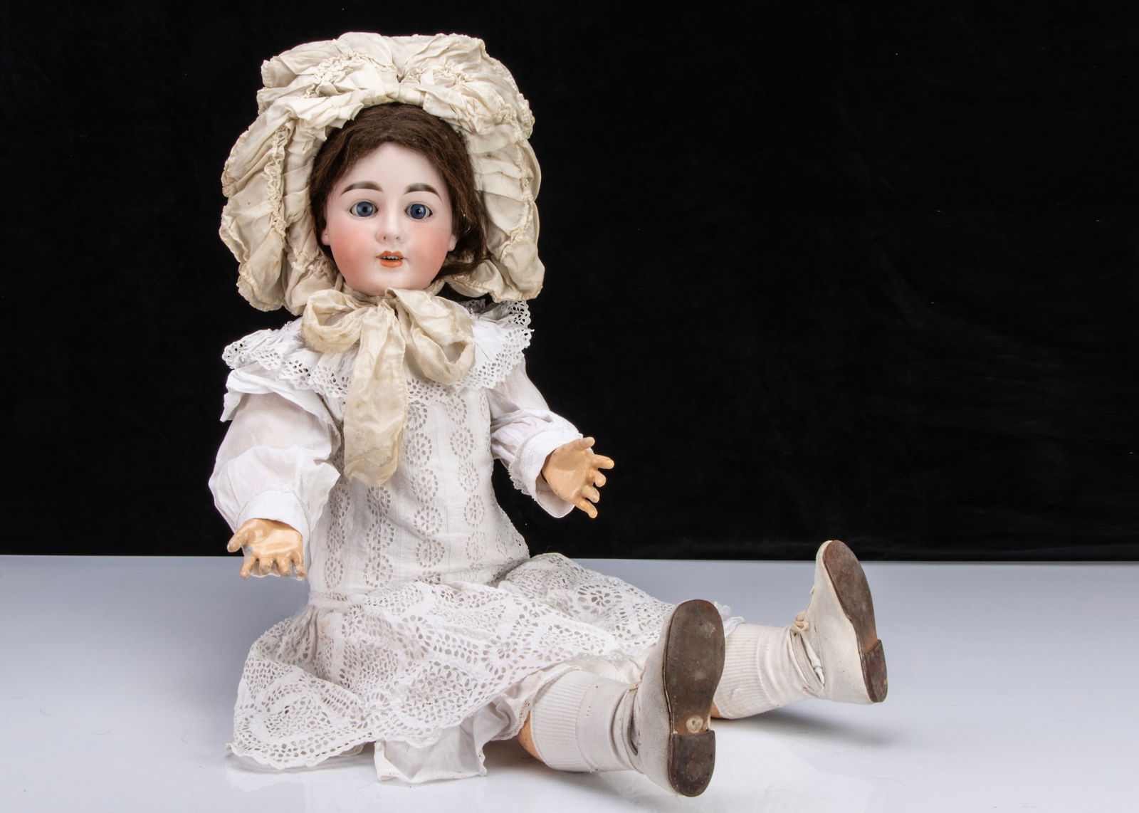 A large German bisque headed doll embossed with I, (1 of 2)