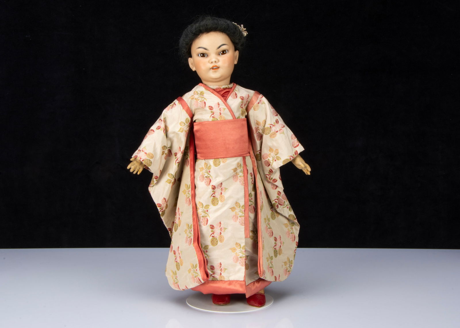 A Simon & Halbig Dep 1129 or 1199 Asian child doll,: *SALEROOM ANNOUNCEMENT - THIS DOLL HAS THREE RESTORED FINGERS.* A Simon & Halbig Dep 1129 or 1199 Asian child doll, with brown sleeping slanting eyes, black painted arched brows, open mouth with teeth