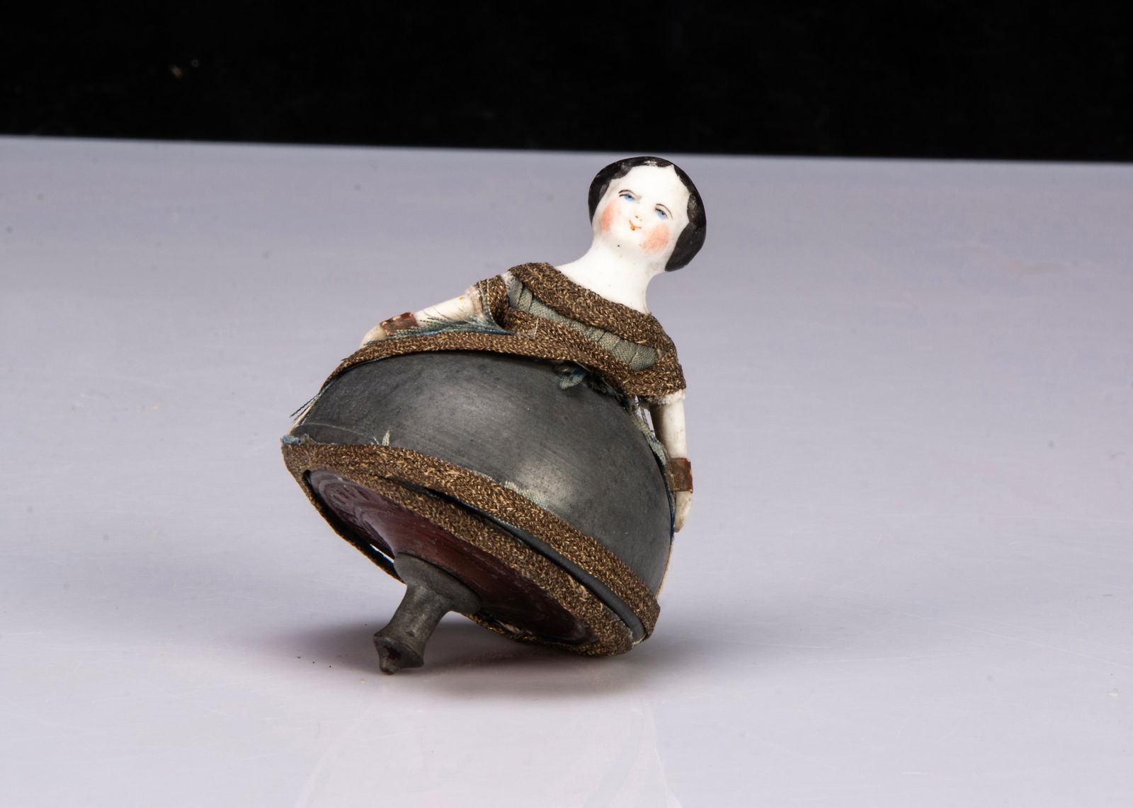 A French bisque headed Toupie spinning top circa 1900, (1 of 2)