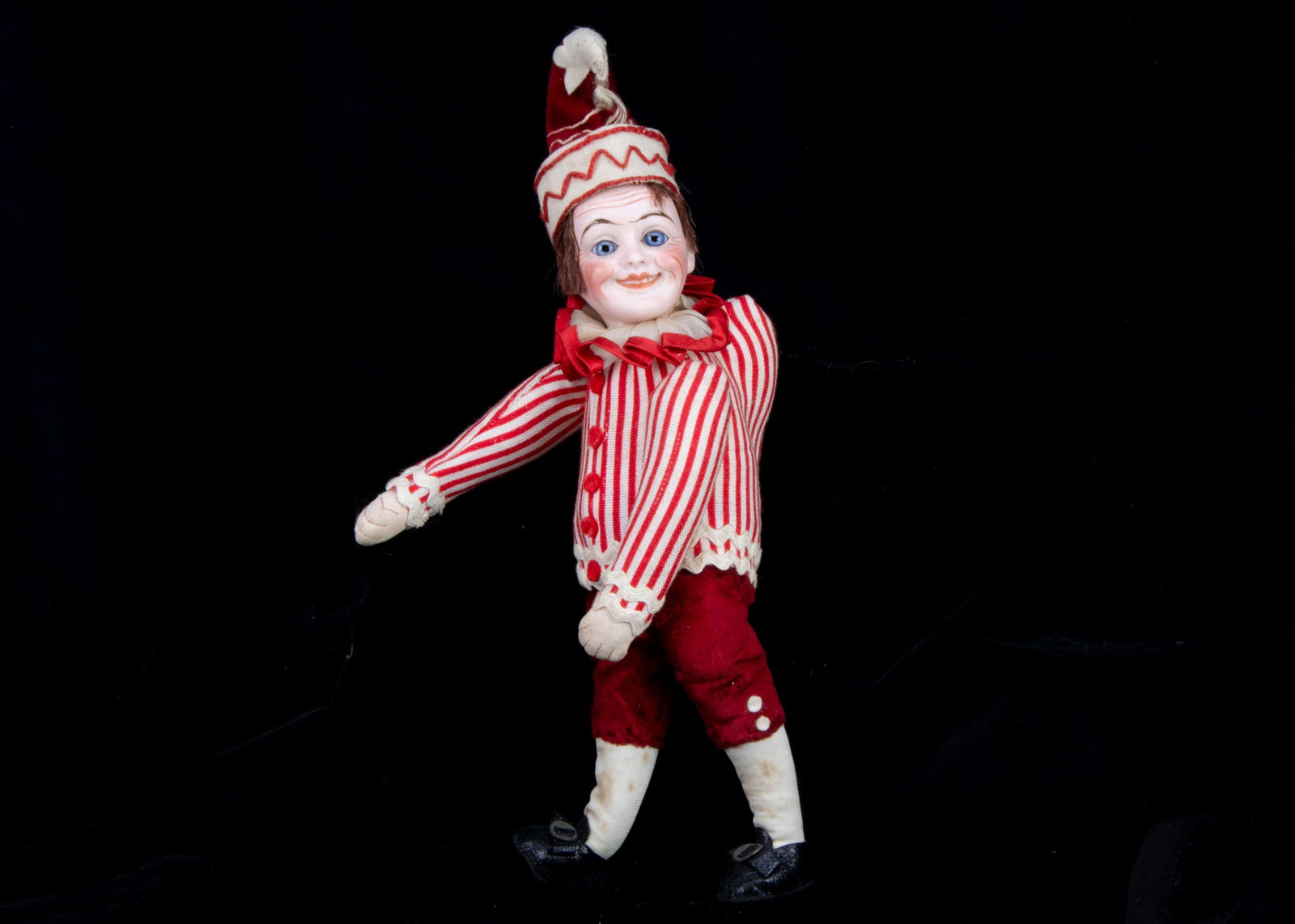 An unusual French bisque headed Mr Punch or Pulcinella doll marked H, (1 of 2)