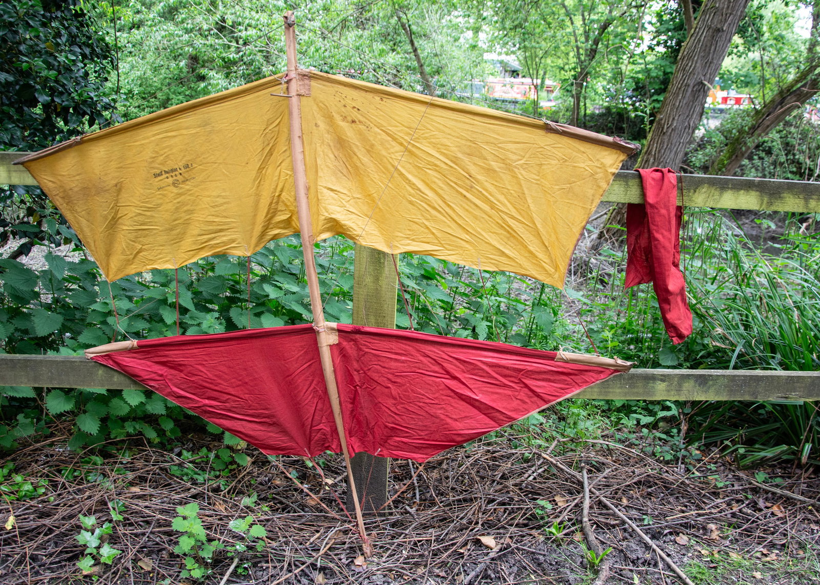 A rare Steiff Roloplan 150/2 Kite,: A rare Steiff Roloplan 150/2 Kite, 1909 -1942, probably pre-war, yellow and red cloth wings, with original red cloth bag ó59in. (150cm.) long; and a Steiff reproduction Rolopan 150/2 kite, 18 of 