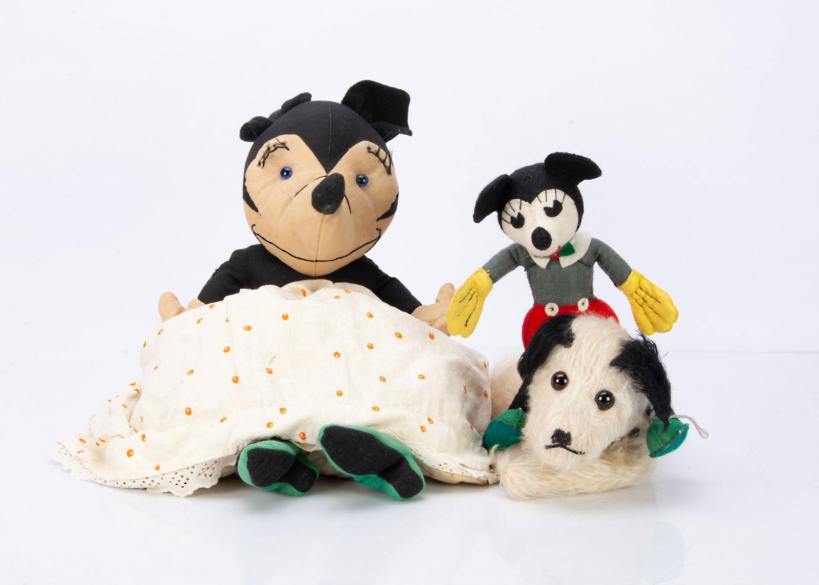 A 1930s Minnie Mouse soft toy,: A 1930s Minnie Mouse soft toy, homemade cloth from pyjama case pattern ó22in. (56cm.) high; a homemade Micky Mouse and a small 1930s dog hank with zip in back (General age related wear to all, Mi