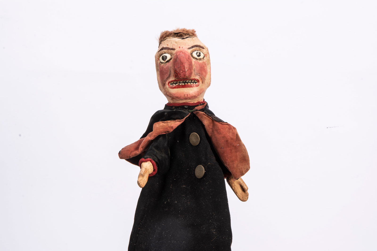 A professional Punch & Judy robber puppet from the Vic Taylor and Billy Norman collection,: A professional Punch & Judy robber puppet from the Vic Taylor and Billy Norman collection, with carved and painted wooden head, protruding nose, skin wig, cloth body with wooden hands, pole which exte