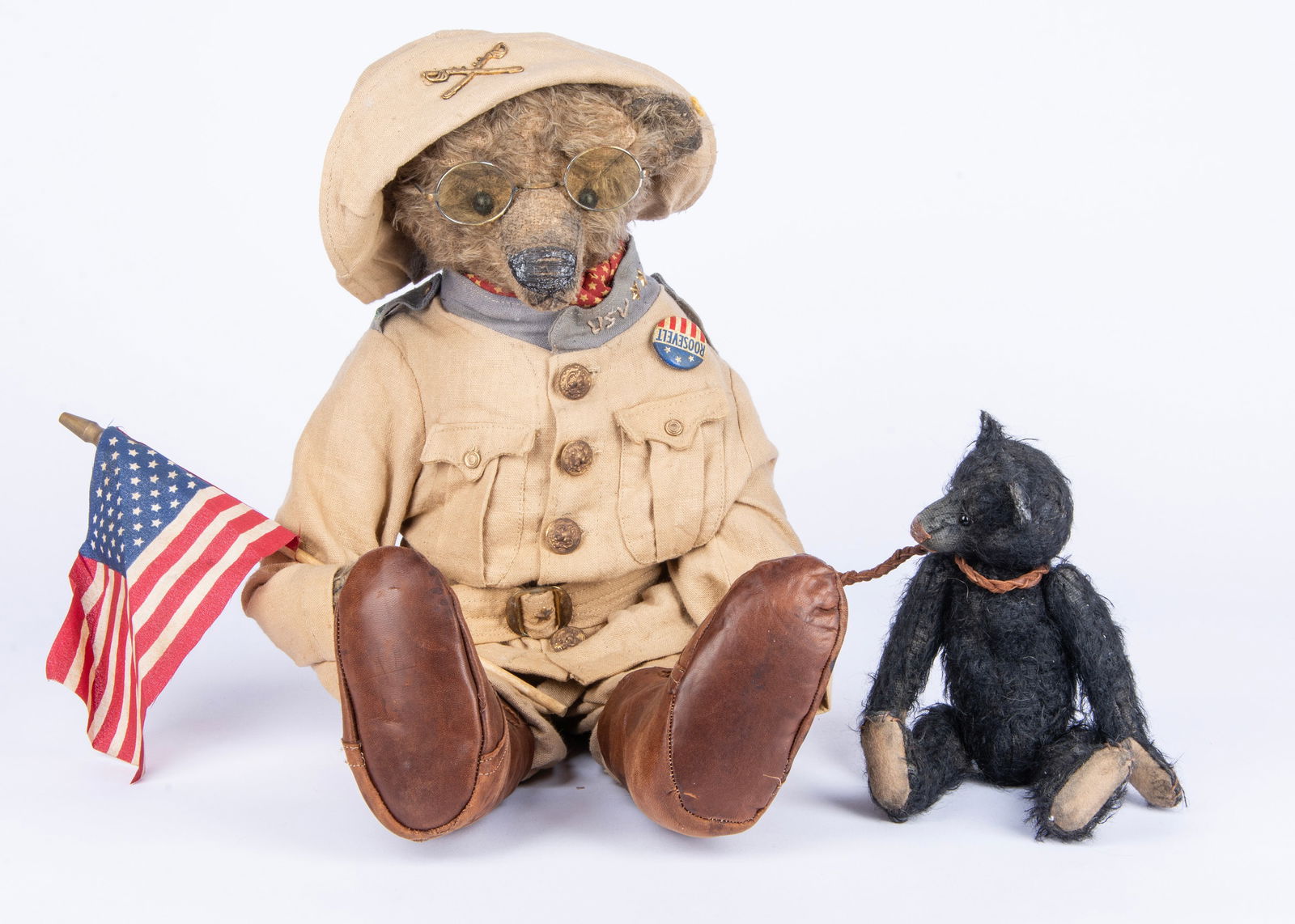 A Sue Lain (USA) Teddy Roosevelt Bear in Rough Rider uniform and black bear cub, circa 2001, (1 of 2)