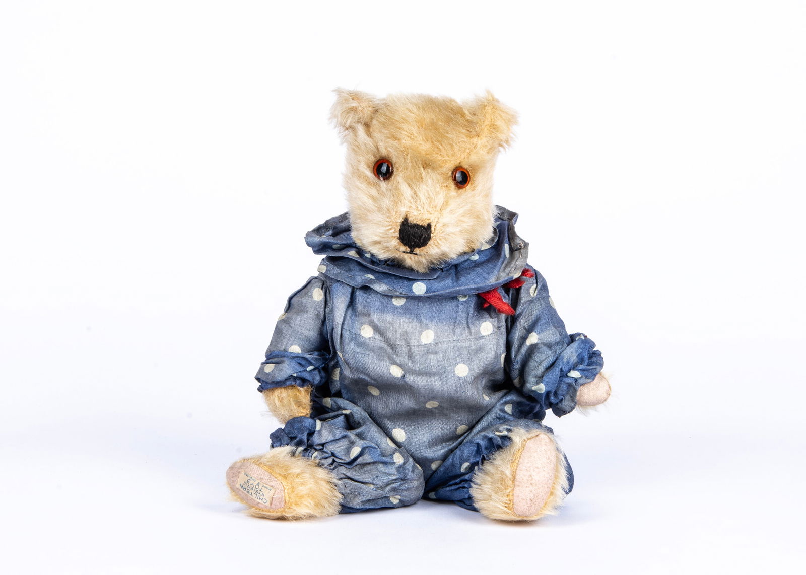 ‘Quincy’, a post-war Chiltern Hugmee Teddy Bear in clown costume, : ‘Quincy’, a post-war Chiltern Hugmee Teddy Bear in clown costume, with golden mohair, orange and black glass eyes, pronounced muzzle, black stitched nose and mouth, swivel head, join