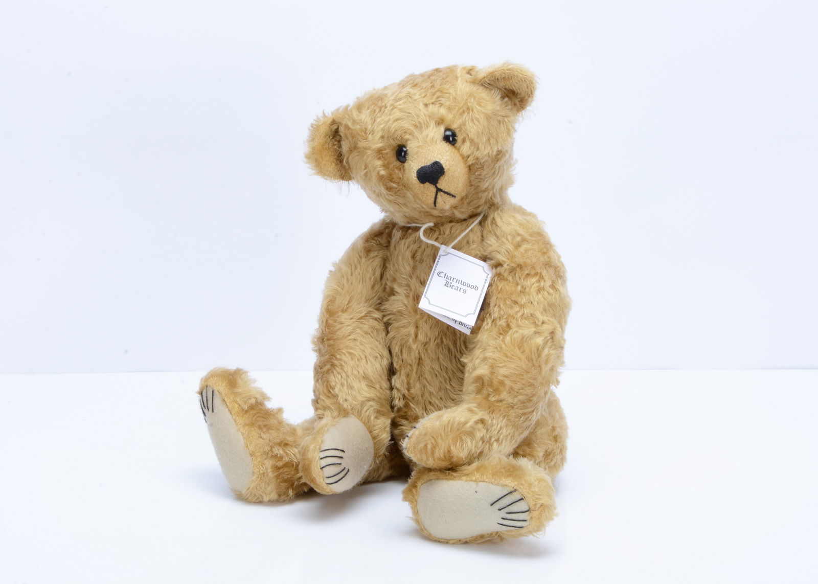 A Charnwood Bears Jarvis teddy bear by Frank Webster,: A Charnwood Bears Jarvis teddy bear by Frank Webster, 1 of 4, with golden mohair, black plastic eyes, black stitched nose, mouth and claws clipped muzzle, swivel head, jointed limbs and card certifica
