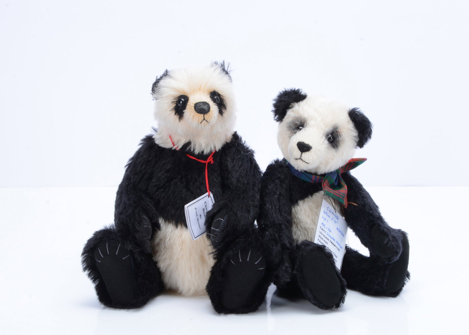 A Charnwood Bears Bamboo Panda bear by Frank Webster,: A Charnwood Bears Bamboo Panda bear by Frank Webster, 2 of 10, black plastic eyes, swivel head and jointed limbs, with card certificate —11 ½in. (29cm.) high; and a Bear Crazee Chang, 1 of