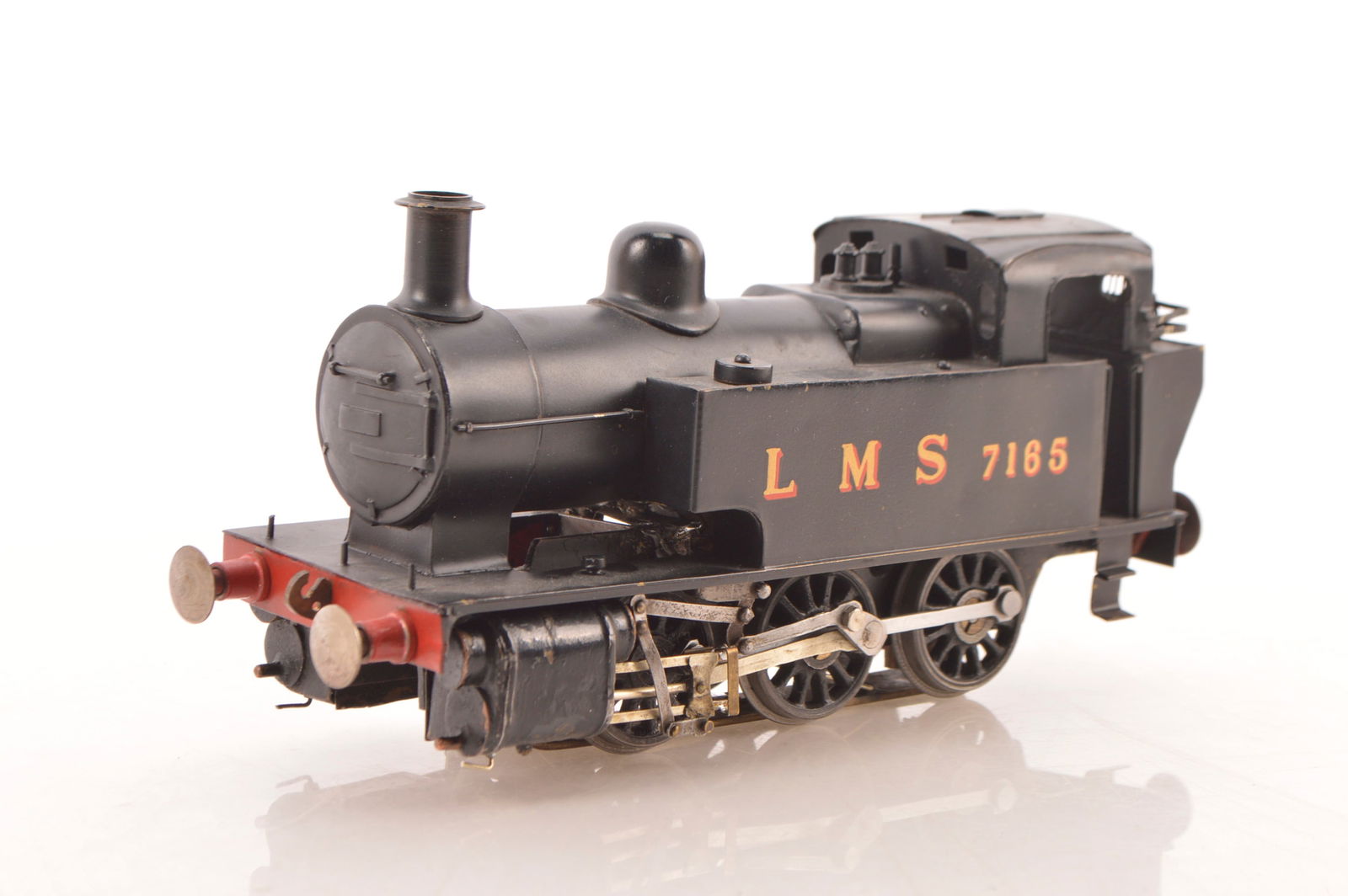 A kit- or scratch-built 0 gauge electric (3-rail) LMS 0-6-0 'Dock Tank',: A kit- or scratch-built 0 gauge electric (3-rail) LMS 0-6-0 'Dock Tank', neatly made and finished in plain black as LMS No. 7165, with substantial brass frames and motor, approx 4" long pick-up skate,
