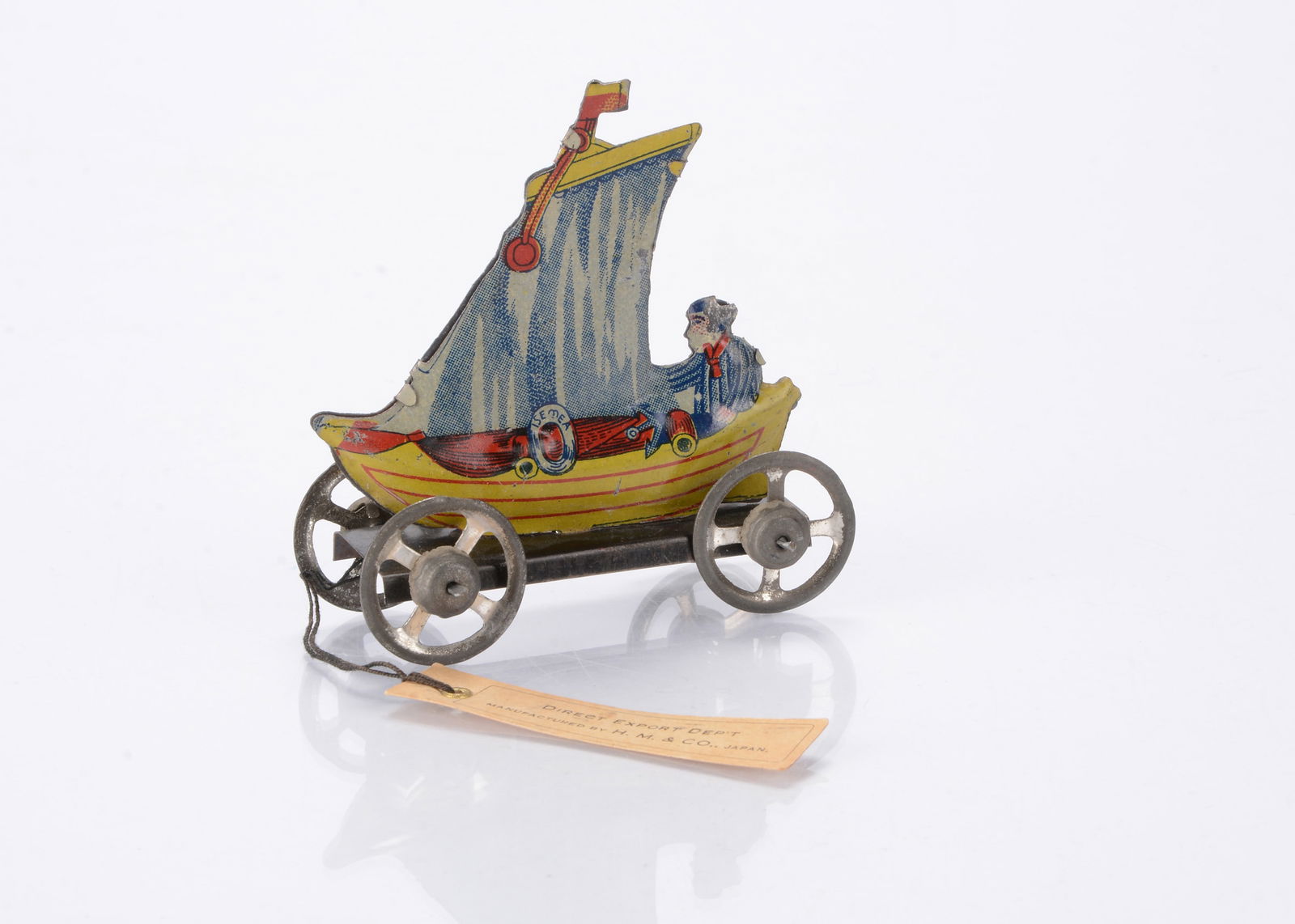 A Japanese Penny Toy sample sailing boat with H.M. & Co card tag, (1 of 2)