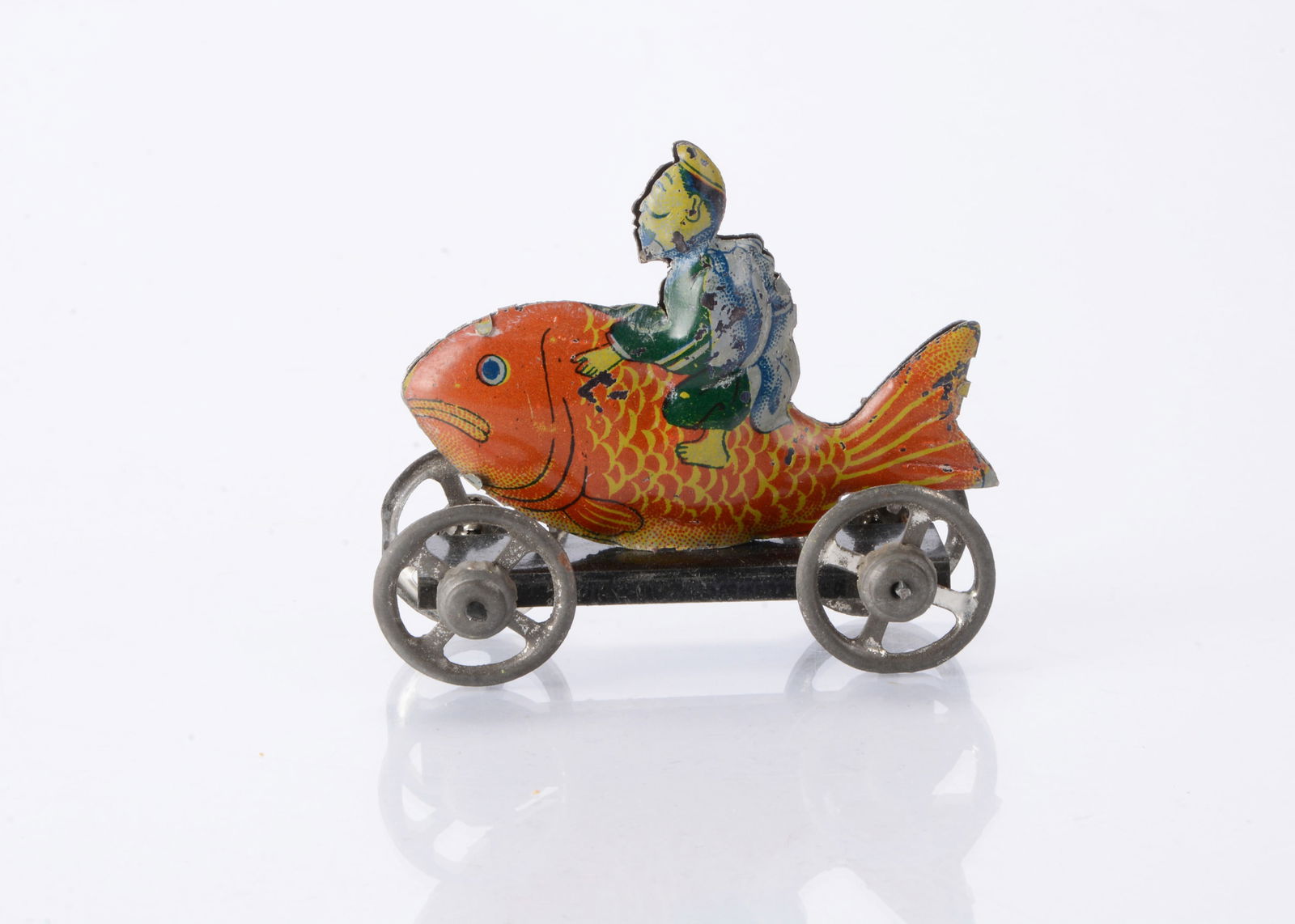 A Japanese Penny Toy of Kink? riding a carp, (1 of 2)