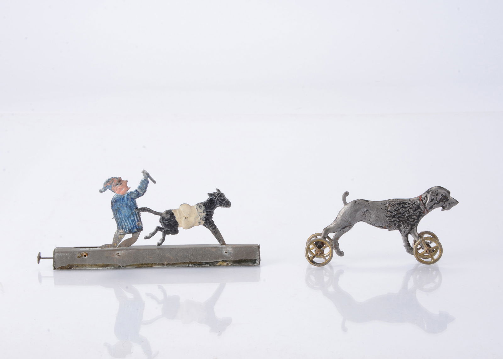 Two Japanese cast-metal Penny Toys, (1 of 2)