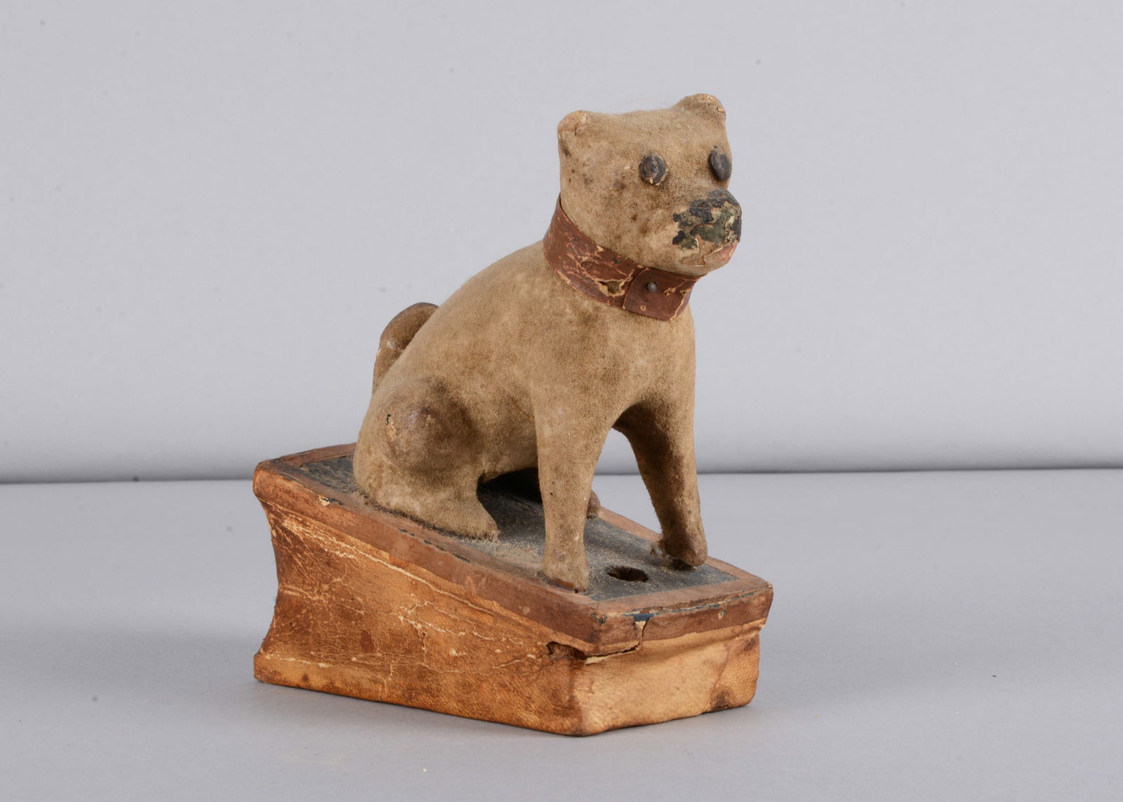 A mid 19th century Thüringen seated pug dog squeak toy, (1 of 5)