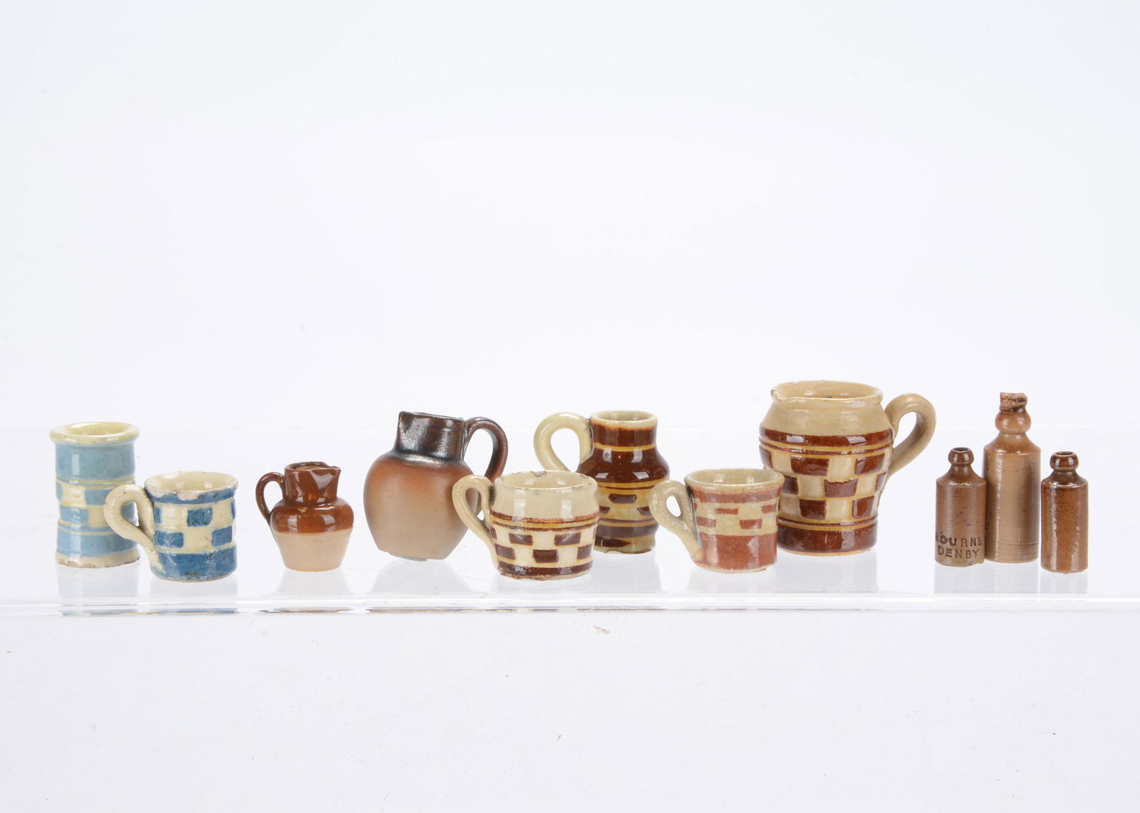 Dolls’ house pottery,: Dolls’ house pottery, six pieces of mochaware in brown and blues —1 ¼in. (3cm.) largest piece; three stoneware bottles, on is stamped Bourne Denby; and two jugs