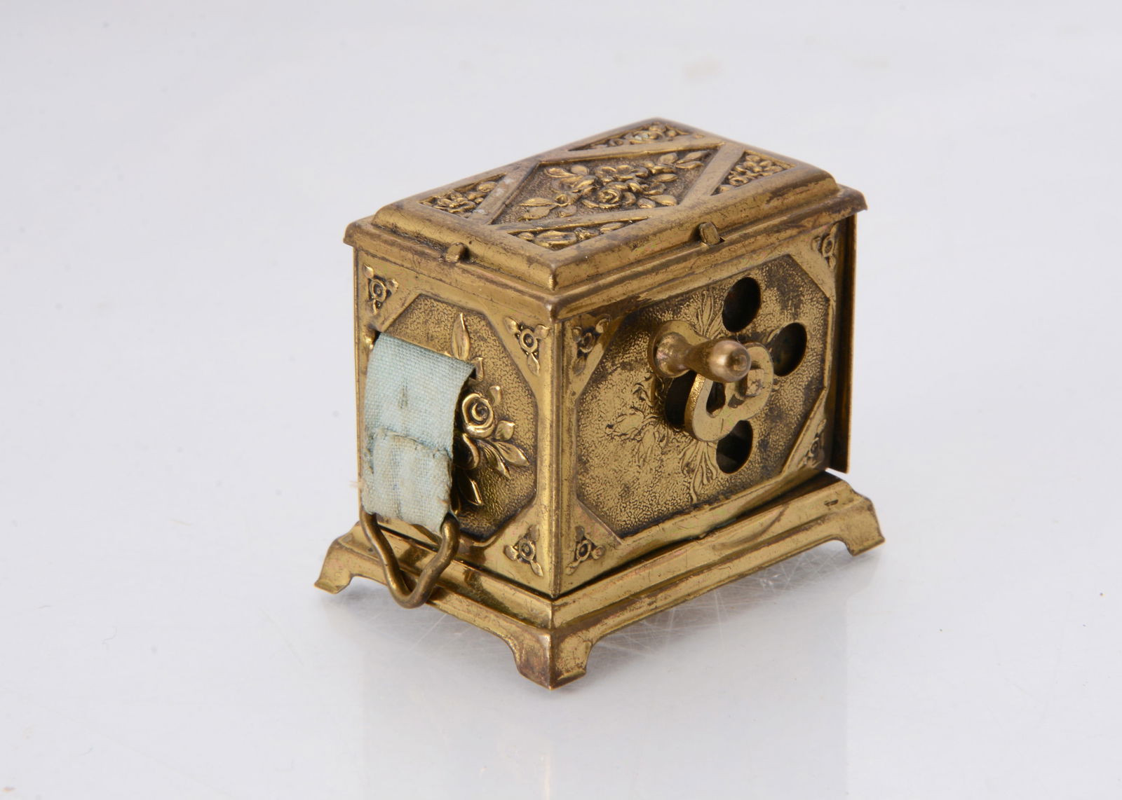A rare late 19th century Punch & Judy brass musical tape measure, (1 of 2)