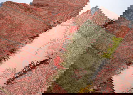 Three 19th century paisley wool shawls,: Three 19th century paisley wool shawls, one of red, blues and greens &#8212;63in. (160cm.) x 127in. (323c.) (small holes and thinning), another square with white centre (a few holes) and another recta