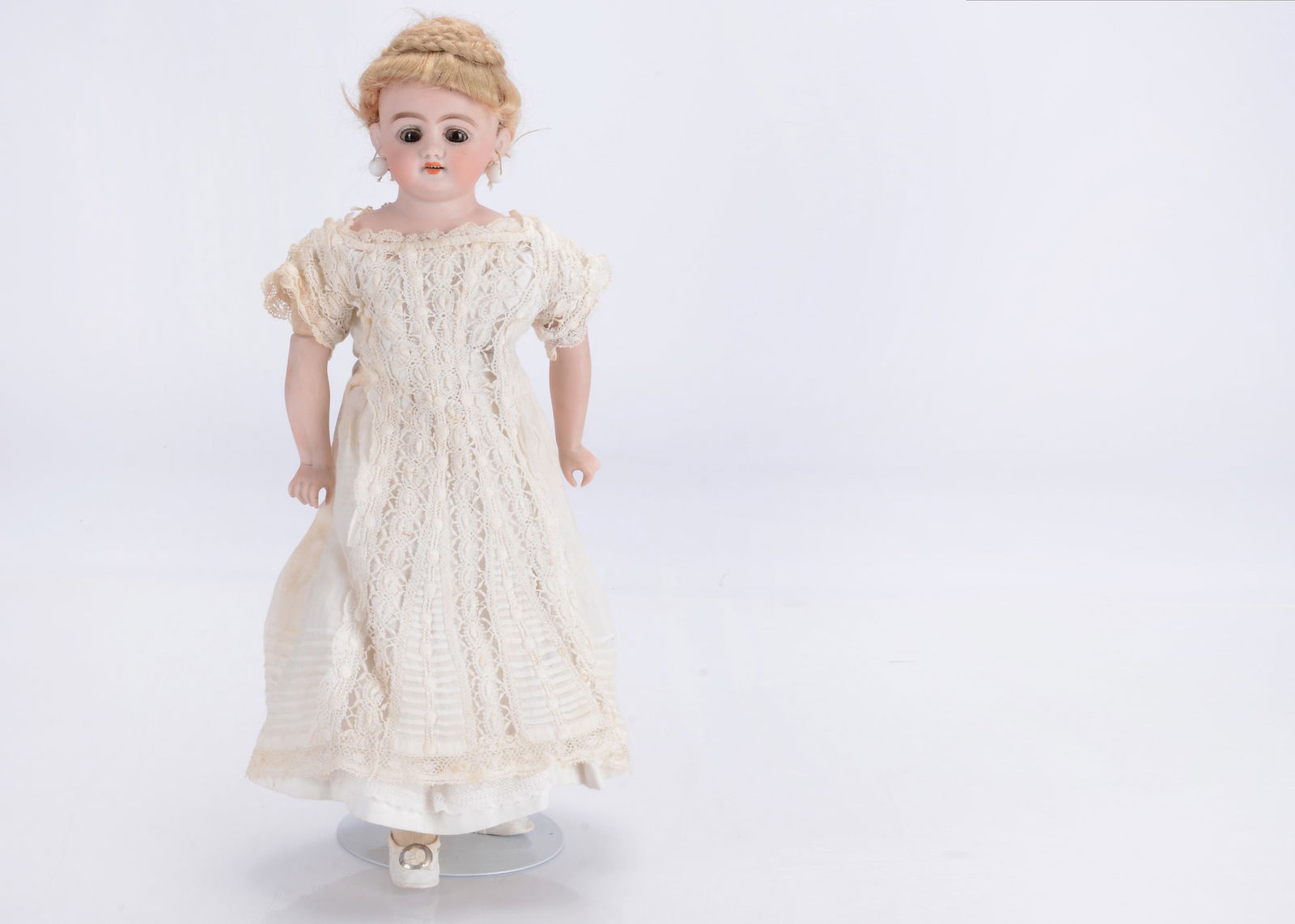 A Simon & Halbig bisque shoulder-head doll,: A Simon & Halbig bisque shoulder-head doll, marked SH1010 2 DEP, all original, with brown glass sleeping eyes, pierced ears with white bead earrings, blonde mohair wig with coiled plaits updo, stuffed