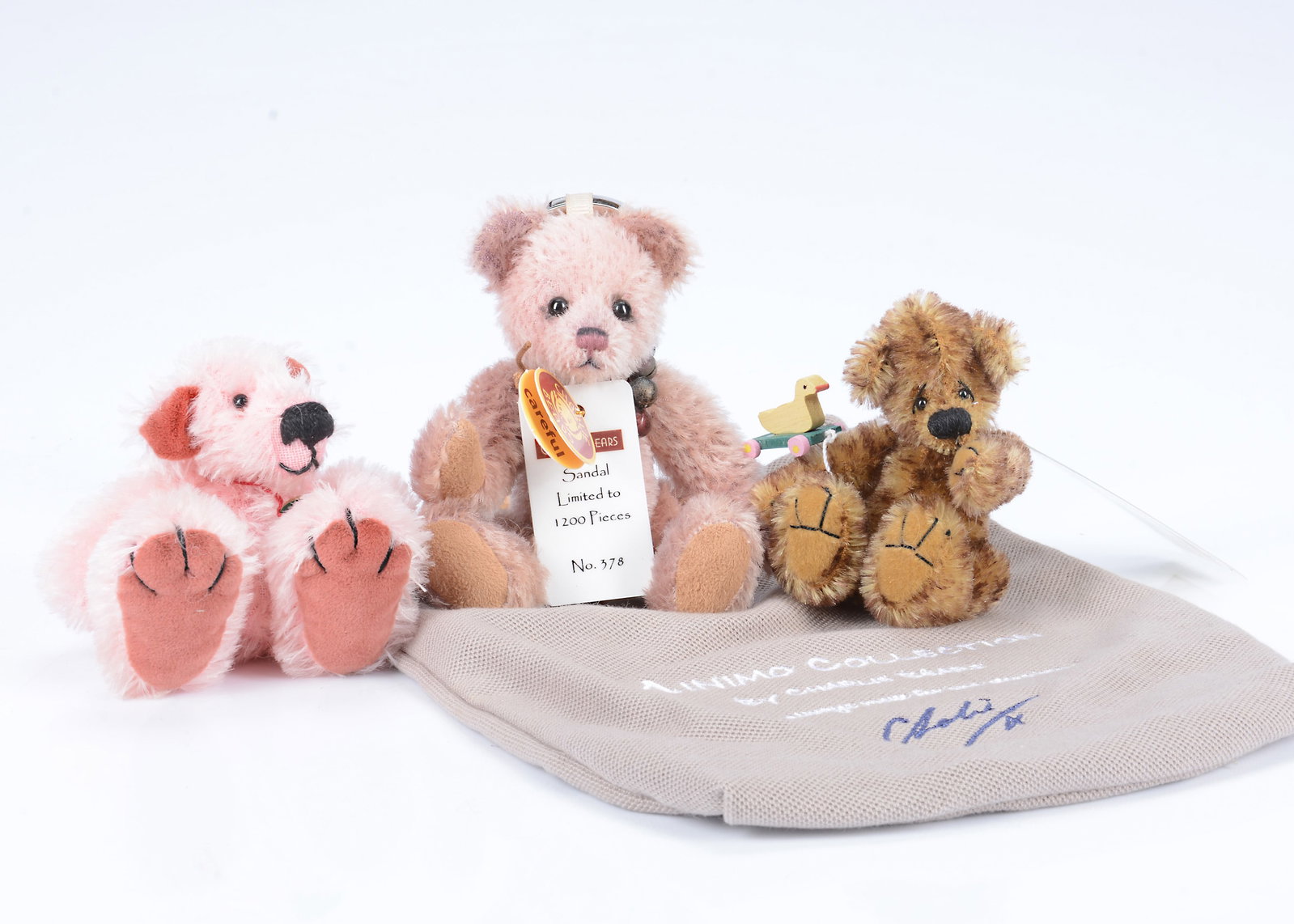 A limited edition Charlie Bears Minimo Collection Sandal,: A limited edition Charlie Bears Minimo Collection Sandal, 378 of 1200, pale pink mohair, with tag certificate and fabric bag --5in. (13cm.) high; a Gyll's Bears Peter with tag certifcate and a Cornfie
