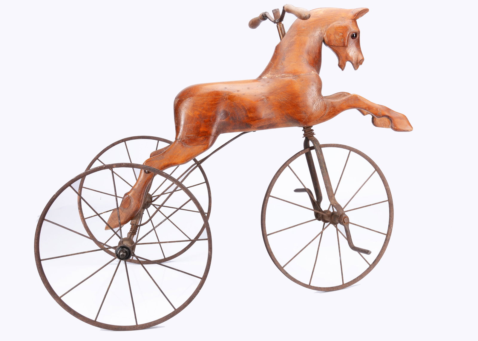 An early 20th century English carved wooden horse velocipede, (1 of 3)
