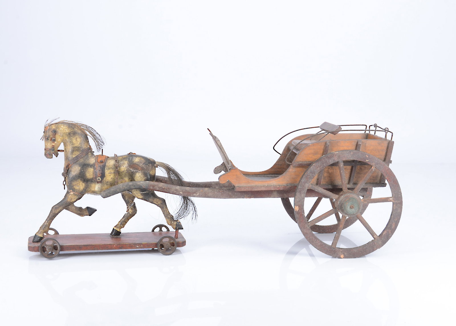 A fine 19th century English pull-along trotting horse and delivery cart, (1 of 2)