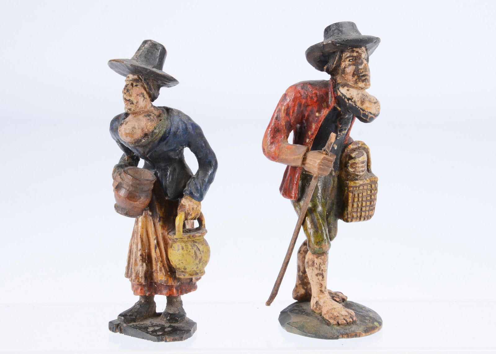 An 19th century European carved wooden couple with Goitre growths, (1 of 3)