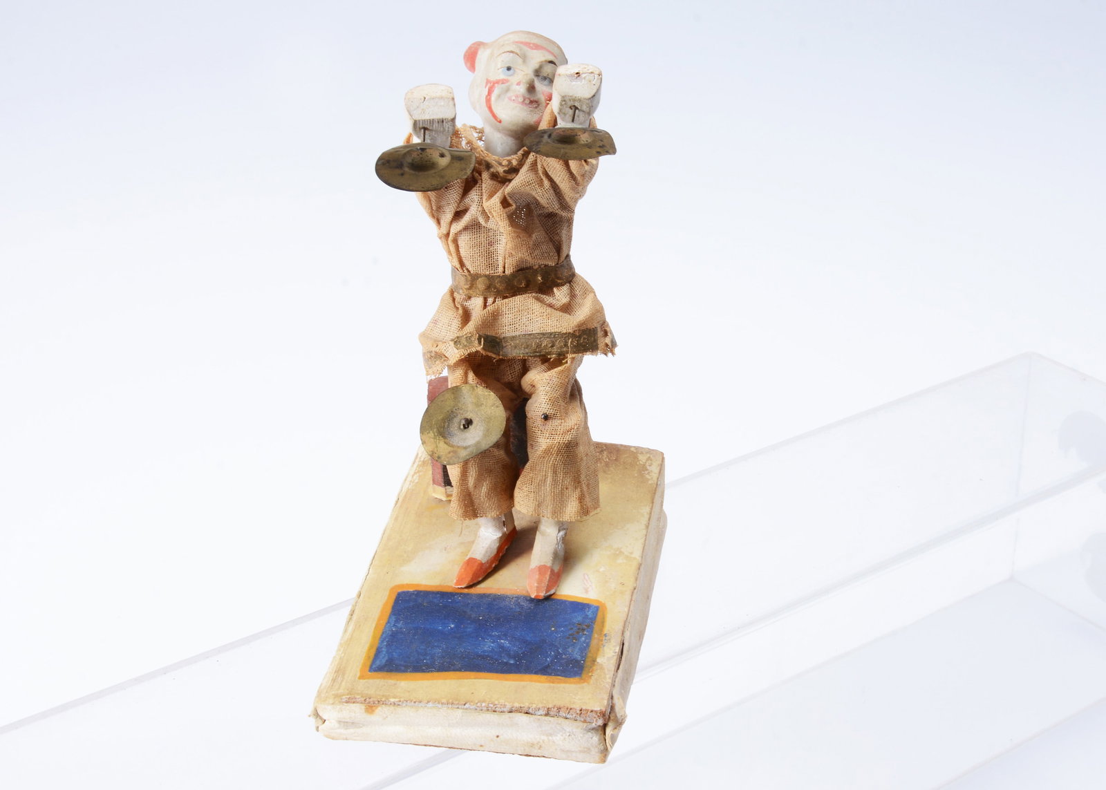 A mid to late 19th century Thüringen white faced clown squeak toy, (1 of 4)