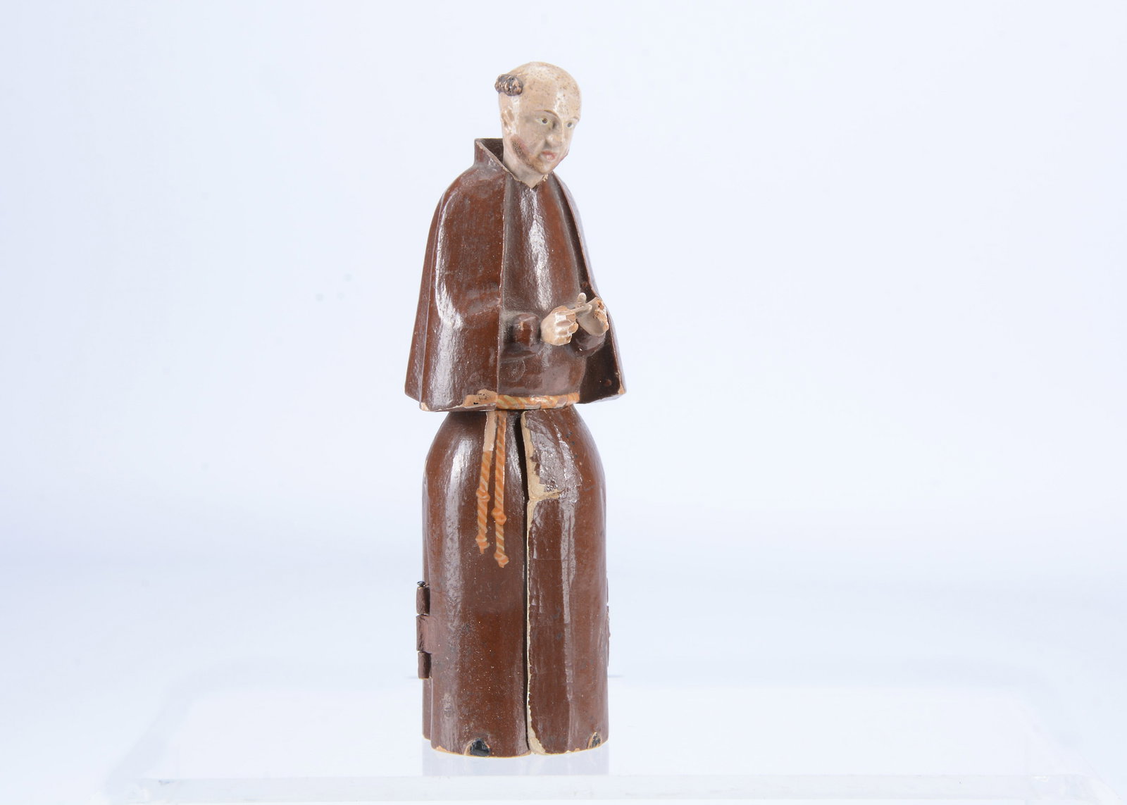 An early to mid 19th century Oberammergau wooden figure of a monk with hidden chapel in robes, (1 of 2)