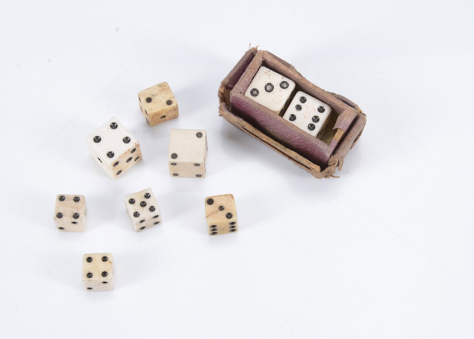 Seven Georgian tax stamped bone dice, (1 of 1)