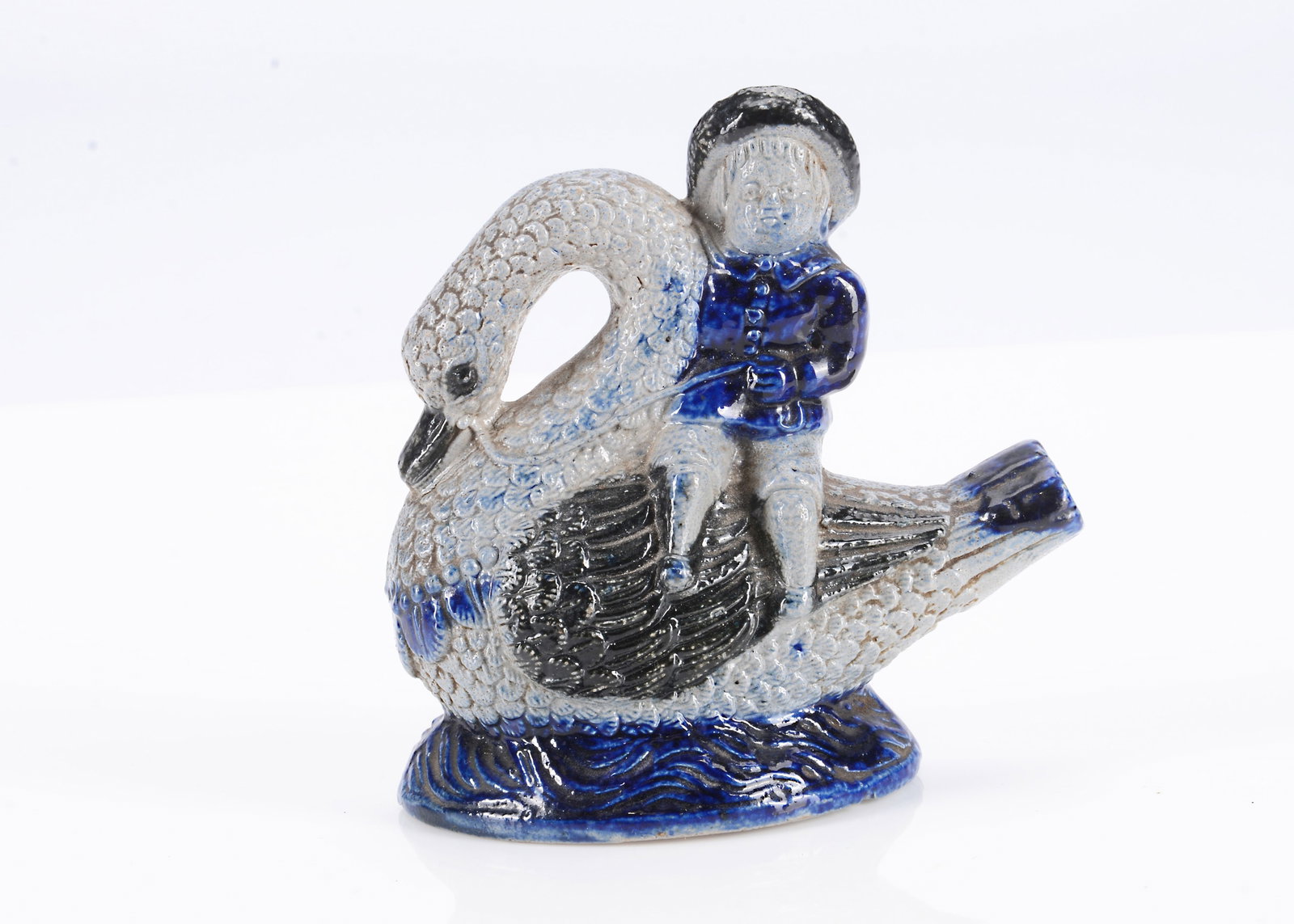An 19th century German stoneware boy riding a swan bird whistle, (1 of 2)