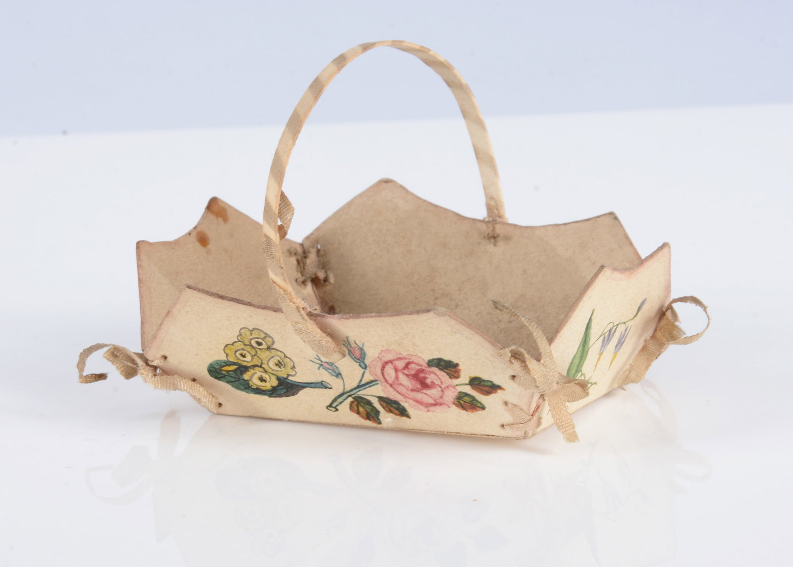 An early 19th century card painted dolls’ basket painted with flowers, (1 of 2)